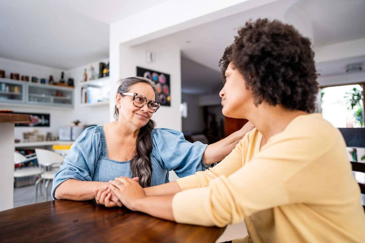 Family carer enjoying a peaceful moment of respite at home while their loved one receives quality support