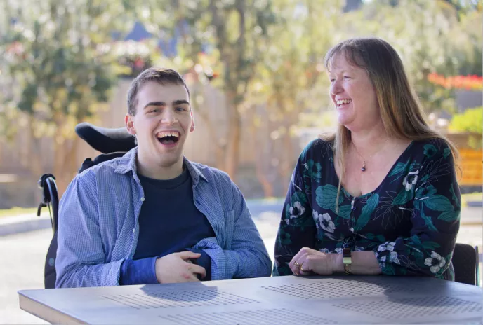 Support worker assisting NDIS participant with daily activities in Gold Coast