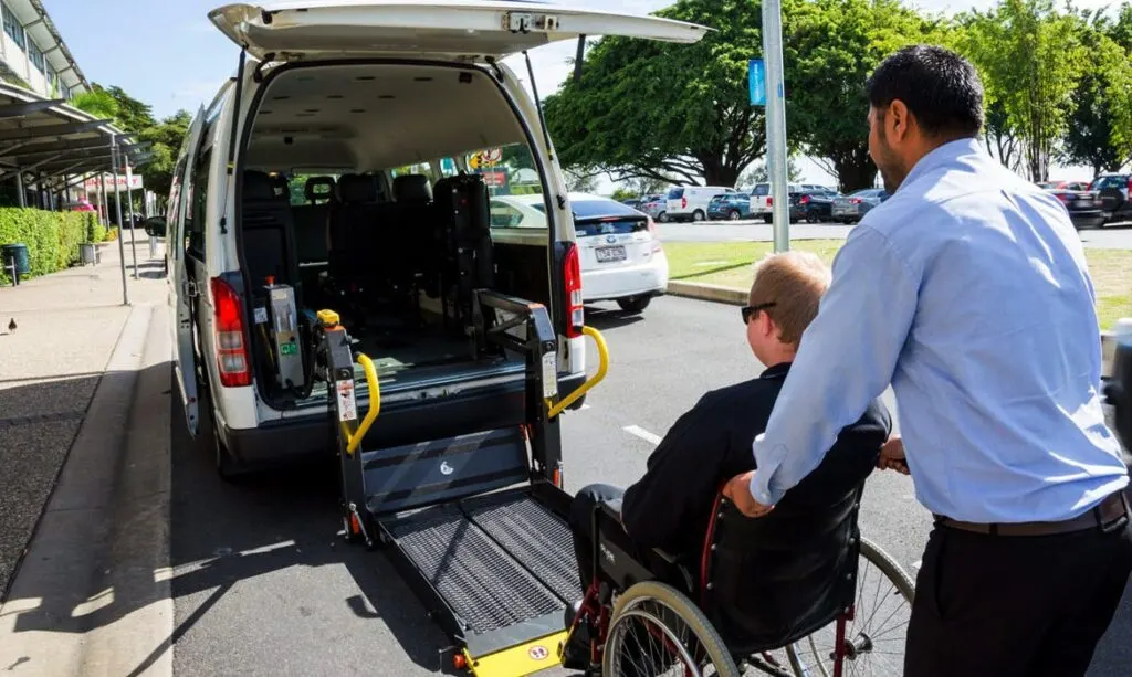 Delight Care support worker providing professional transport assistance to NDIS participant in Logan